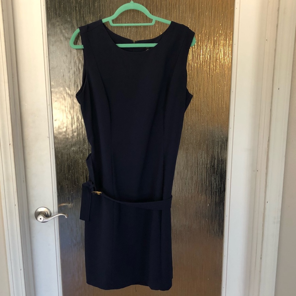 Sleeveless navy blue dress. Great for work.